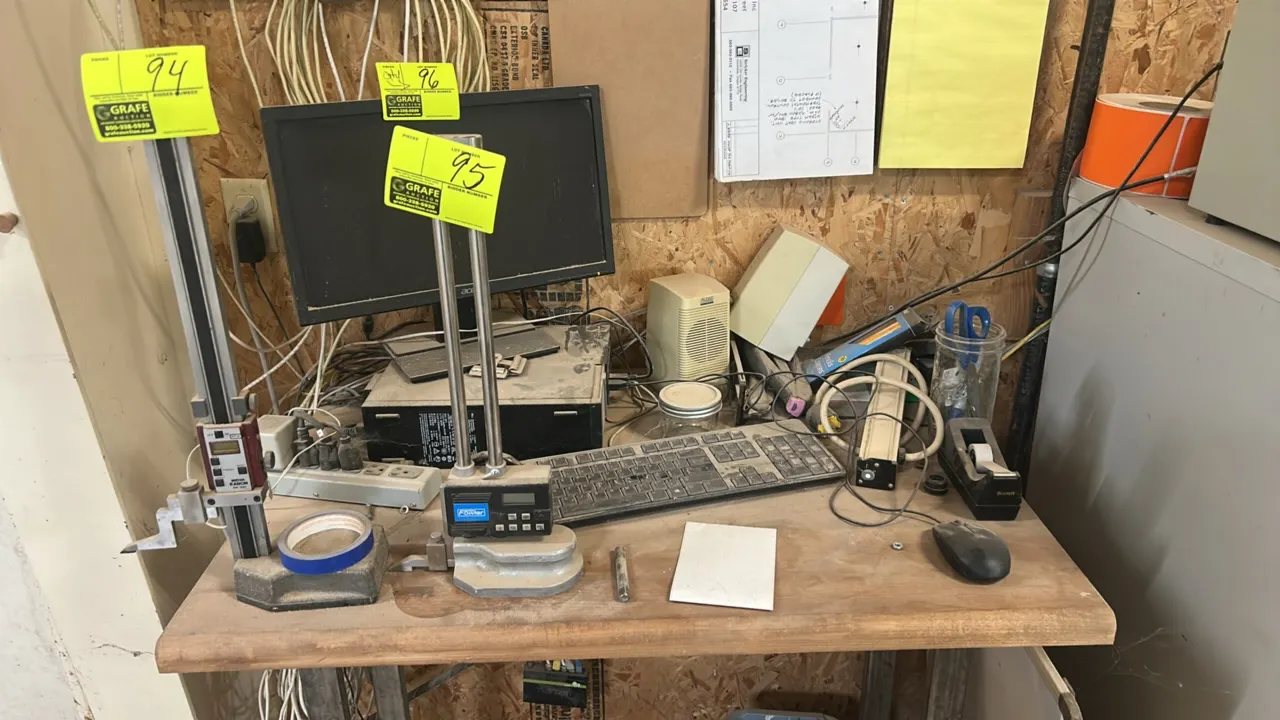 Computer workstation accessories and tabletop contents. Includes Acer LCD monitor, desktop computer unit, desktop speakers, keyboard, mouse, power str