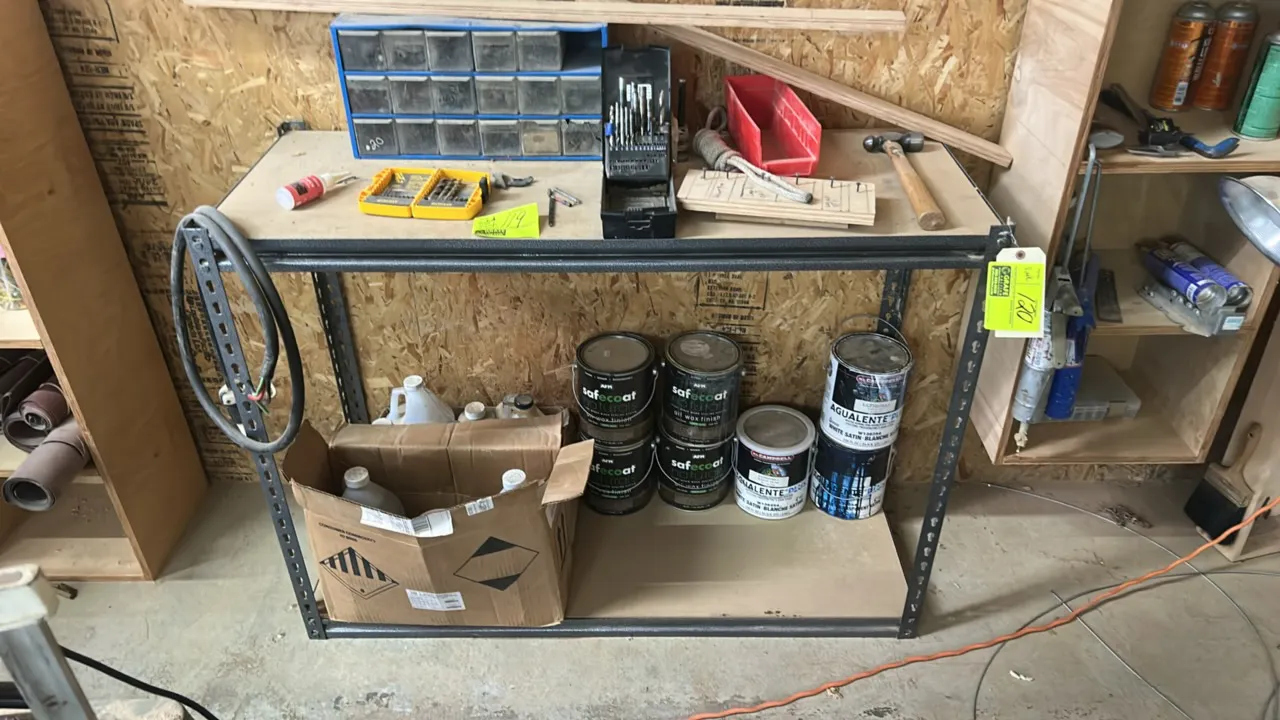 2-tier metal storage rack. Features a gray metal frame and composite shelf decking. 48"W x 18"D. Contents not included.