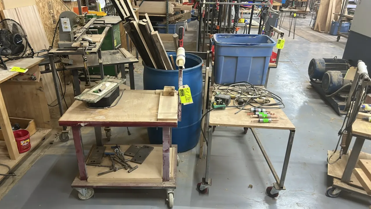 Mobile utility carts with wood tops and metal frames. Includes (1) 42" cart and (1) 32" 2-tier cart. Each mounted on swivel casters. Includes remainin