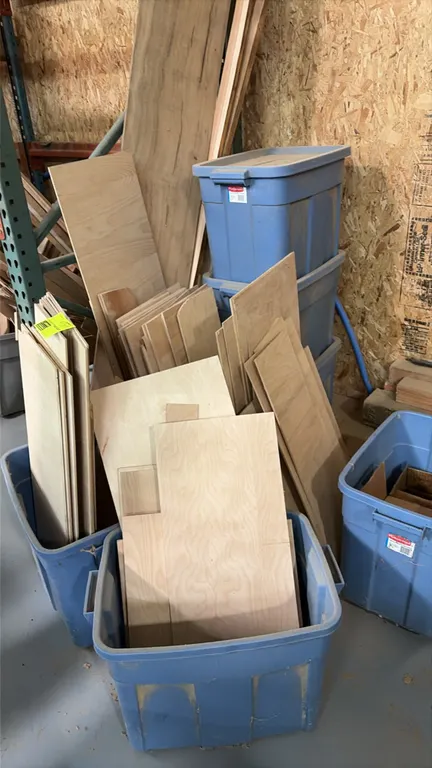 Lot of (10) plastic storage totes with assorted wood. Includes various plywood cutoffs, dimensional wood pieces, and board remnants.