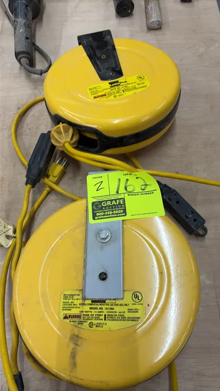LumaPro 1A136A retractable cord reels. Features yellow housing, cord stop, multi-outlet power block, and mounting bracket. Electrical: 125V, 60 Hz, 10