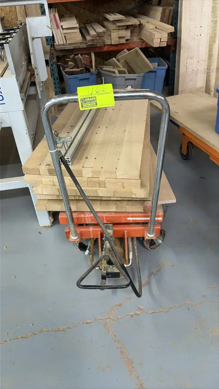 Pneumatic mobile lift cart with assorted wood panels. Features pneumatic foot control mechanism, tubular push handle, and 4-wheel mobile base. Include