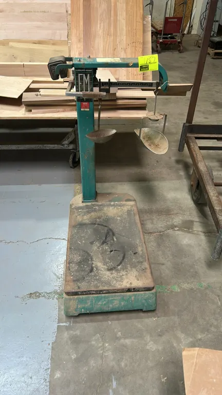 Fairbanks-Morse mechanical platform beam scale. Features cast metal construction, graduated weigh beam with sliding poise, counterpoise weight hanger