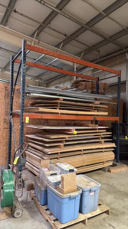 Pallet racking unit. Features (2) upright frames, orange 4.5" cross beams, and wire mesh decking. 11'L x 3'8"W x 11'H. Contents not included.