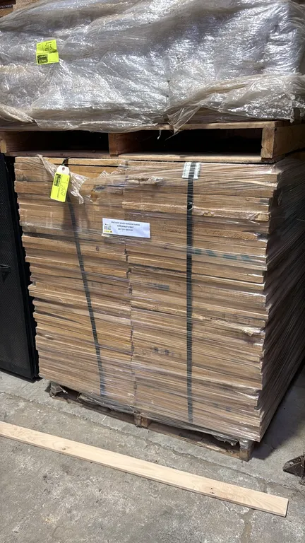 Pallet of hardwood cutoff boards. Individual boards measure 22" x 0.75". 43"H stack height. Banded and stretch-wrapped on a wooden pallet.