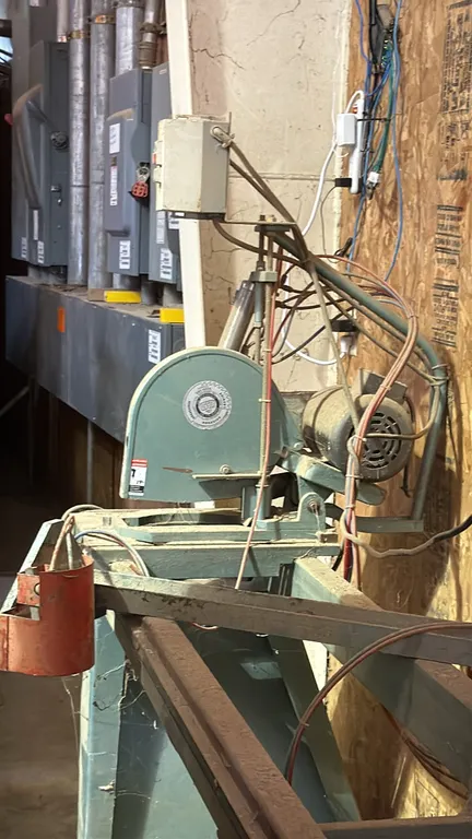 CTD dual cutoff chop saw. Features dual adjustable cutting heads, pneumatic hold-down clamps, electric motors, push-button controls, and integrated st