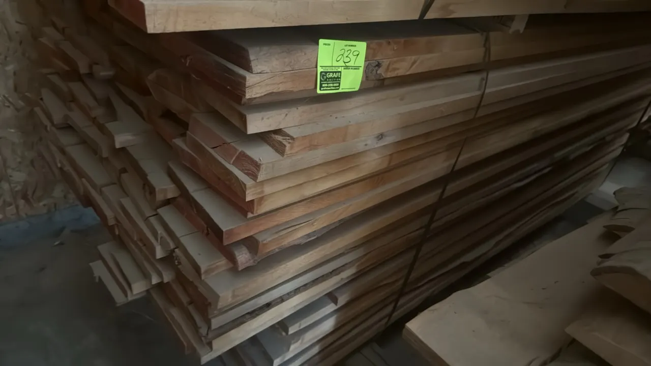 Assorted wood boards. Includes a skid of stacked lumber measuring approximately 9' x 3'5" x 3'2"H. Board thickness ranges from 1.25" to 1.5".