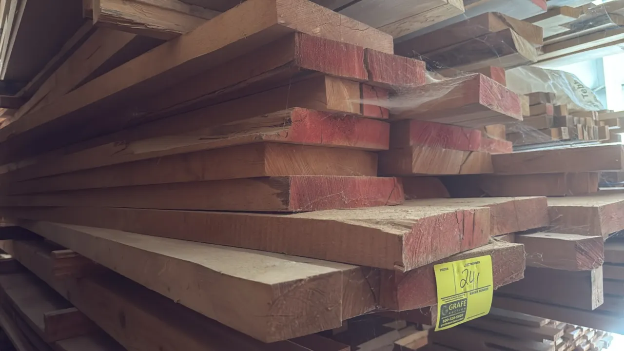 Skid of assorted wood boards. Features 1.75" thick lumber with red sealed ends. Stack measures approximately 9' x 3'5" x 1'4"H.
