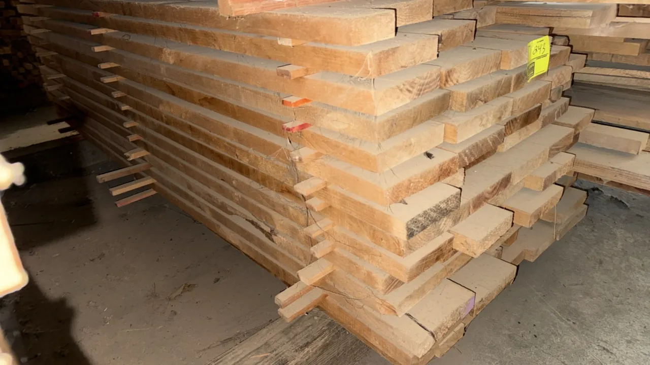 Skid of assorted wood boards. Features assorted thicknesses and lengths stacked with wood spacers/stickers. Approximately 9'L x 3'5"W x 2'4"H.