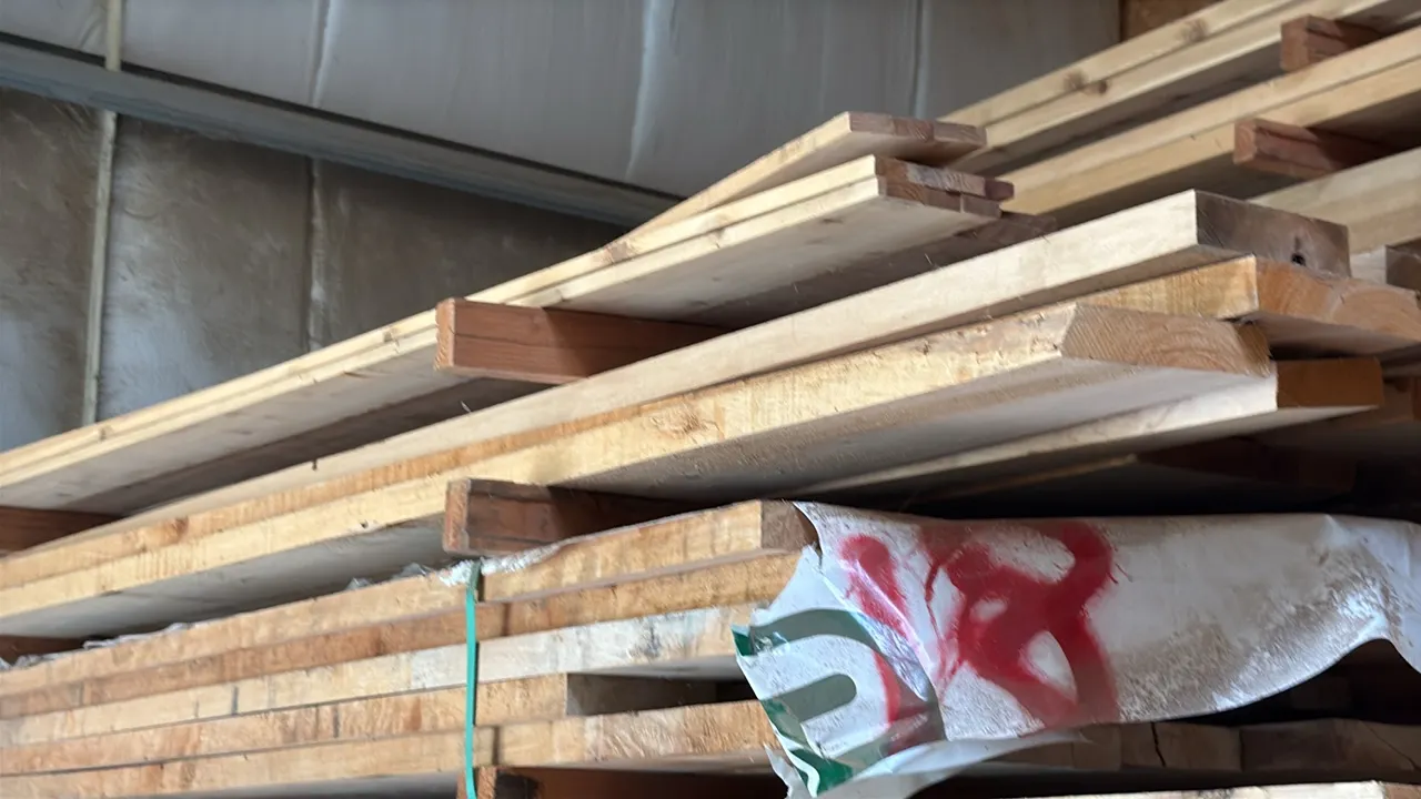 Skid of assorted wood lumber boards. Features various widths and thicknesses. Stacked on skid. Approximately 10' x 3' x 2'7"H.