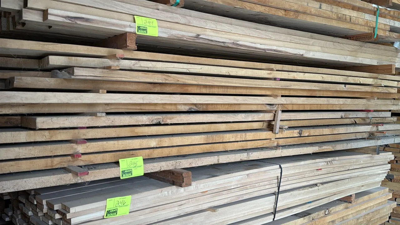 Skid of assorted wood boards. Features rough-sawn lumber in assorted widths and thicknesses. Approx. 10' x 3' x 1'8"H.