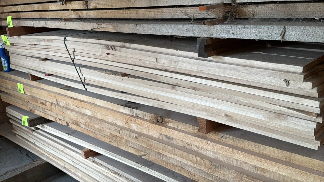 Skid of assorted wood boards. Features 3/4" thick lumber in assorted widths. Stack measures approximately 7'L x 3'W x 1'H.