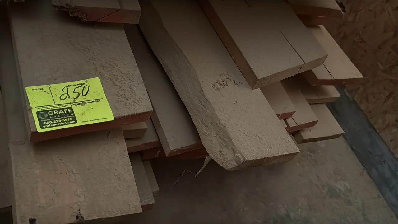 Skid of assorted wood boards. Features rough and dimensional lumber in varying widths and thicknesses. Approximately 10' x 3' x 1'3"H.