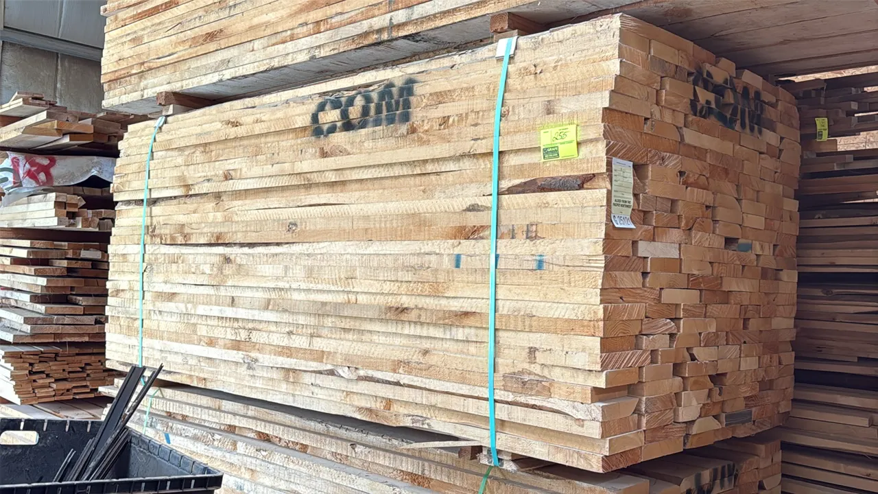 Assorted alder wood lumber boards. Features 6/4 (1.5" thickness) Common grade Pacific Northwest alder, banded on a skid. Tag indicates 1,168 board fee