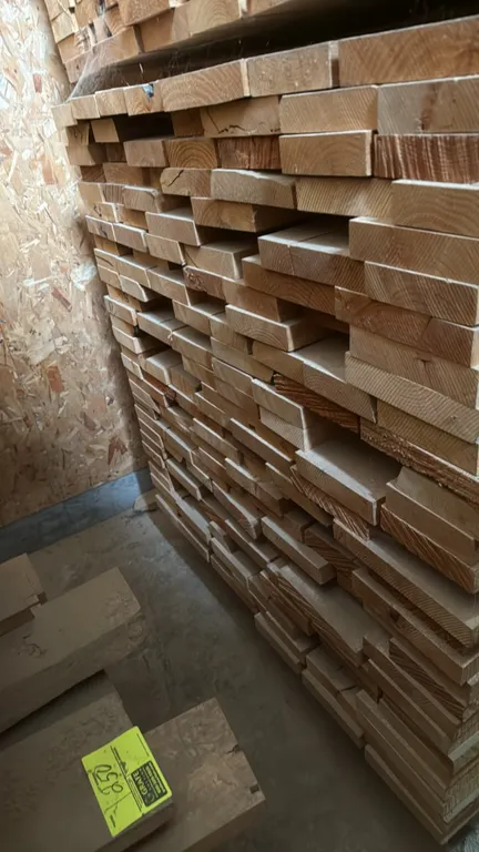 Skid of assorted alder wood boards. Features rough sawn hardwood lumber in assorted thicknesses. Banded stack on pallet. Approximately 10'L x 3'8"W x