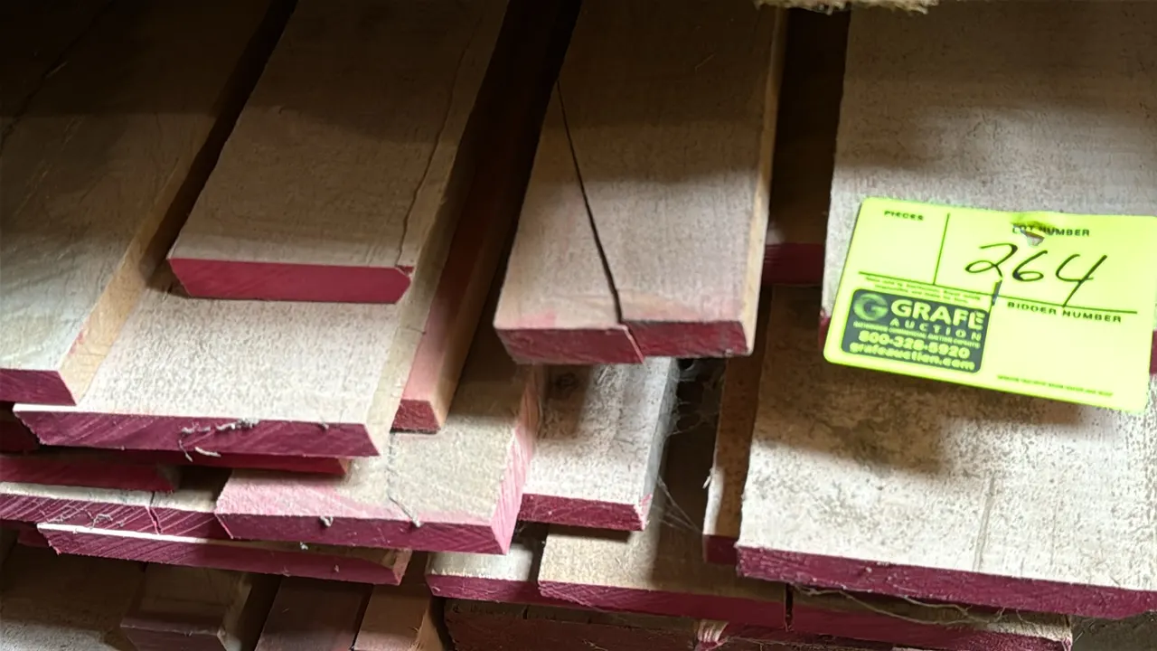 Skid of assorted wood boards. Features painted ends. Approx. 10'L x 3'7"W x 1'3"H stack. Boards are 1" thick.