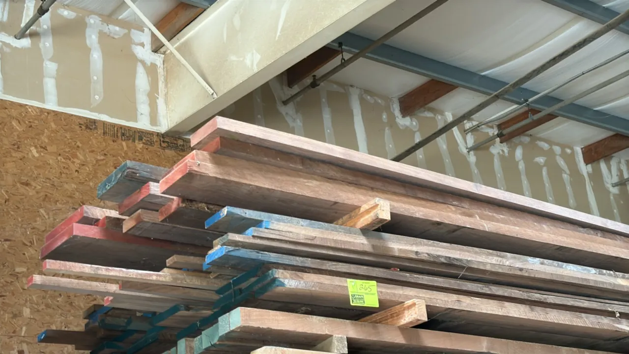 Skid of assorted wood boards. Features hardwood lumber boards in assorted thicknesses and lengths with color-coded sealed ends. Approximately 9'L x 3'