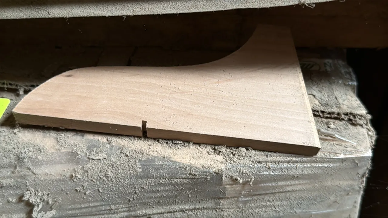 Pallet of alder cut stock wood components. Features shaped cut stock pieces measuring 3.375" x 0.5" x 8.125". Shrink-wrapped on pallet.