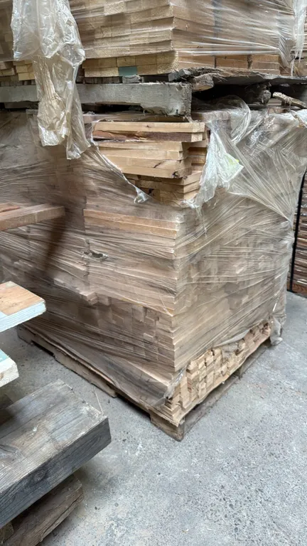 Pallet of cut stock lumber boards. Features 1" thick cut wood stock boards. Dimensions: 40" x 47" x 44"H. Stacked and shrink-wrapped on a wooden palle
