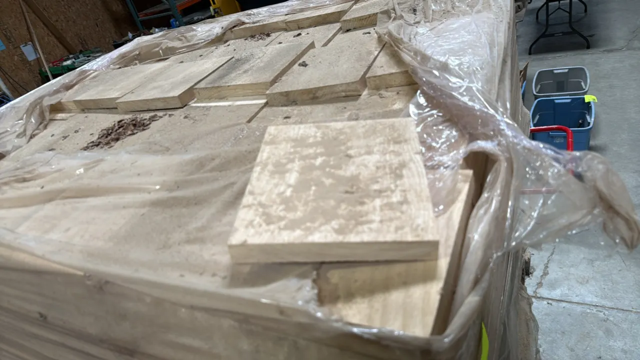 Pallet of cut wood stock blocks. Each piece measures 6.5" x 7.5" x 1". Palletized and stretch wrapped.