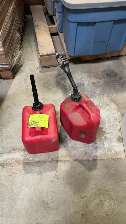 2-gallon plastic gas cans. Features red molded plastic construction, integrated carry handles, and attached pour spouts.