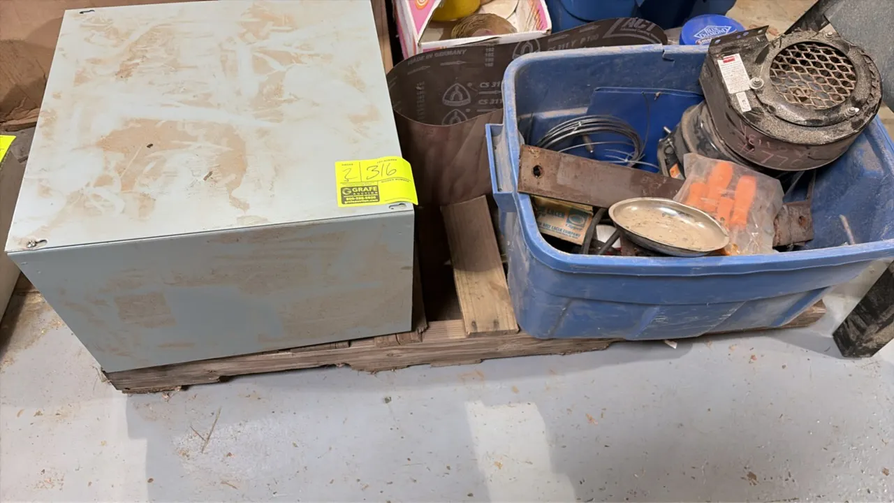 Package lot including a metal storage enclosure and a plastic tote containing miscellaneous parts, hardware, wiring, a small blower motor assembly, sa