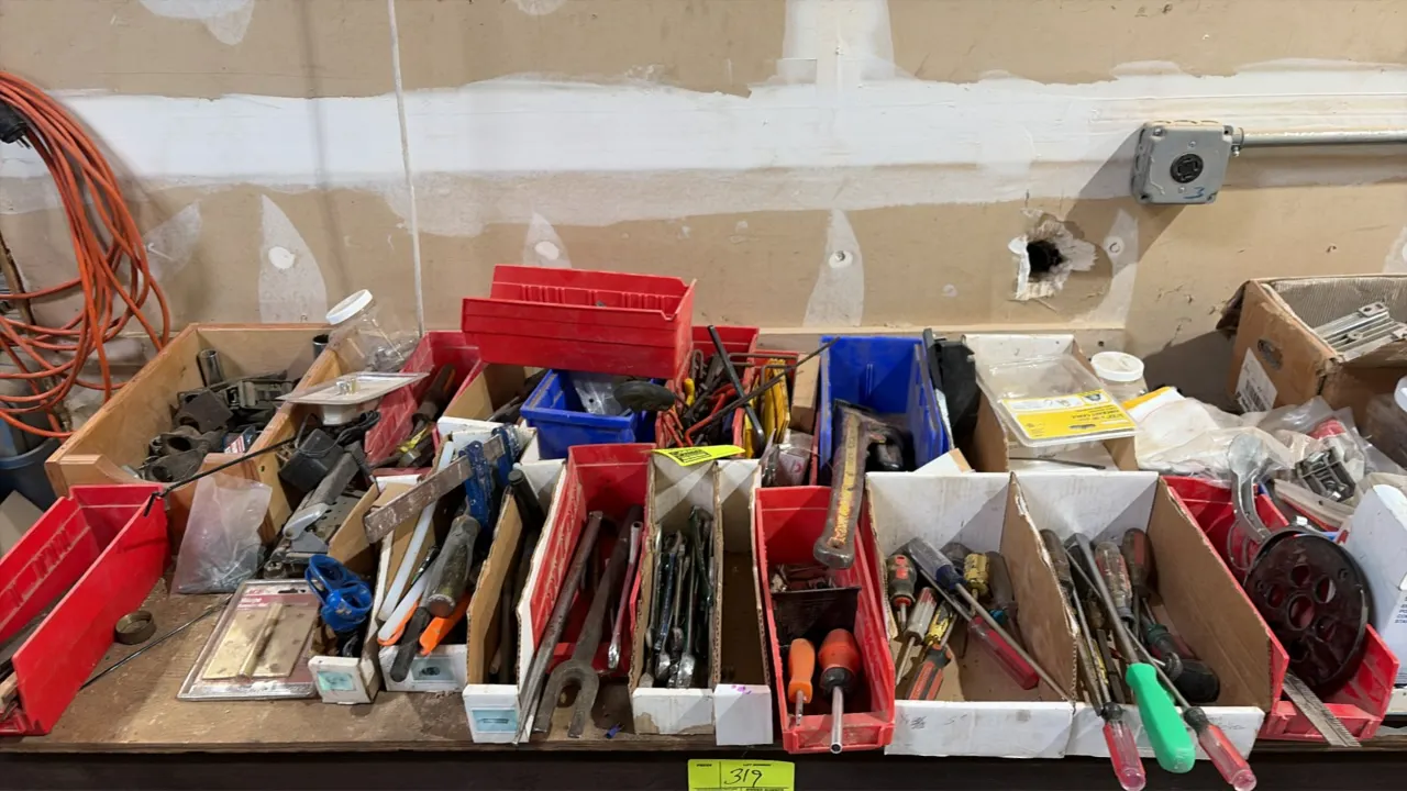 Assorted workshop hand tools and hardware lot. Includes combination wrenches, screwdrivers, assorted small hand tools, fasteners, hardware, and plasti