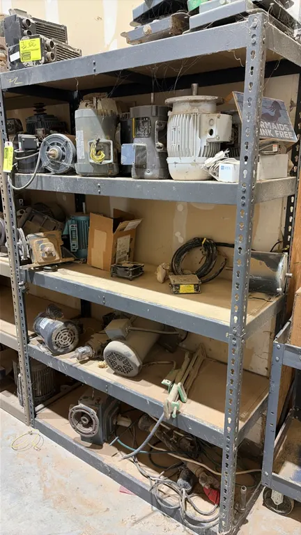 5-tier metal shelving unit. Features adjustable shelf levels with wood composite decking and a slotted steel frame. 48"W x 18"D x 72"H. Contents not i