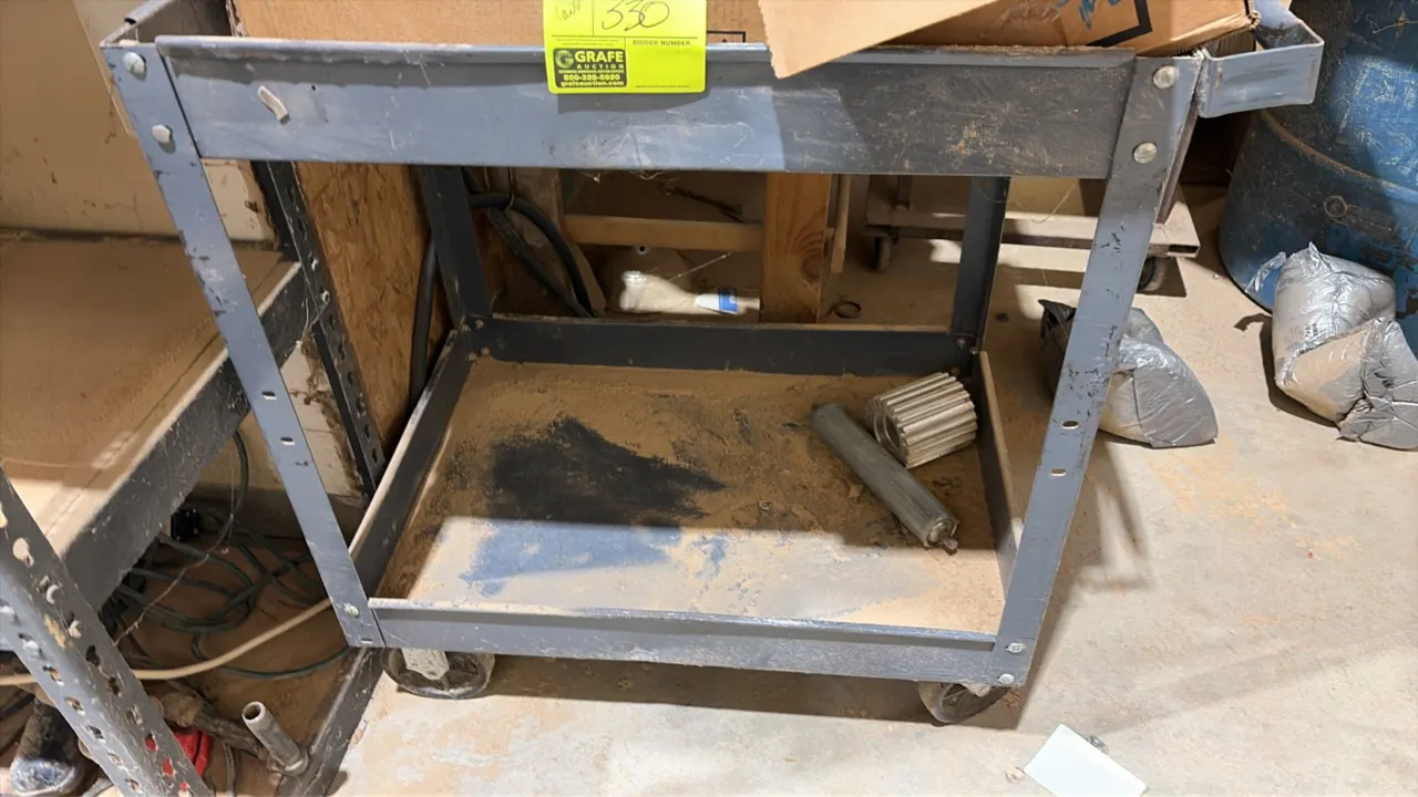 Metal 2-shelf utility service cart. Features painted steel construction, integrated push handle, and 4 casters. Contents not included.