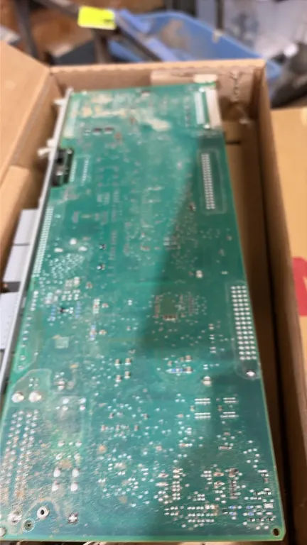 Siemens circuit board and computer hardware. Includes circuit board assembly with technical documentation sheet and modular enclosure unit.