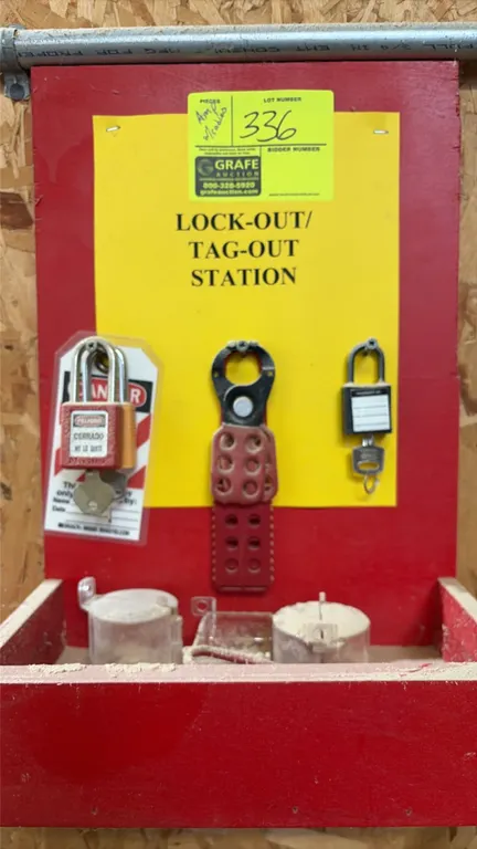 Lockout tag-out station. Features wall-mount backboard with lower storage compartment, safety lockout padlocks with keys, lockout hasp, tags, and asso