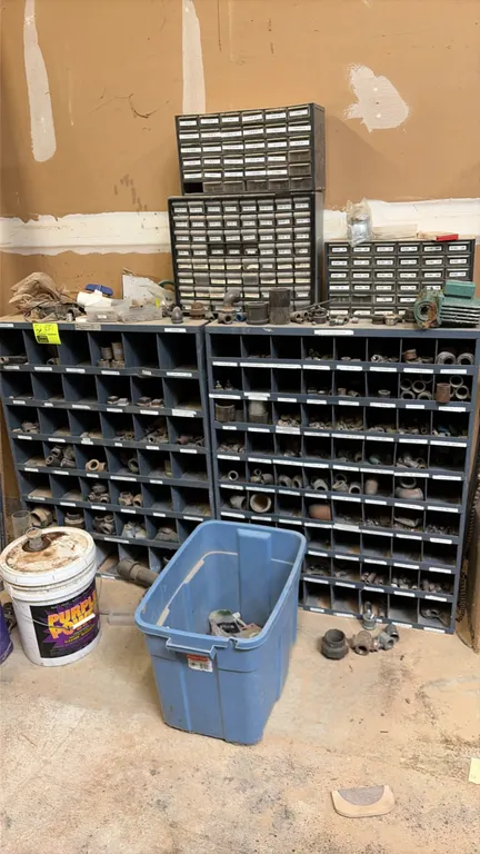 Durham metal parts bins. Industrial steel construction featuring multi-compartment storage with labeled shelf lips. Includes (1) large-compartment uni