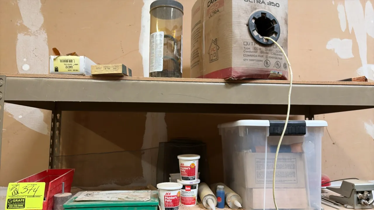Lot of miscellaneous maintenance and hardware supplies. Includes electrical junction boxes, hardware fittings, cable/wire, plumber's putty, toggle cla