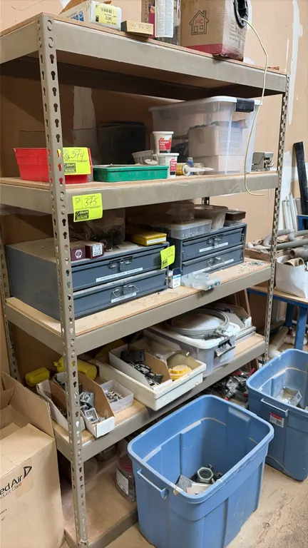 Metal boltless shelving unit. Features a 5-tier metal frame with wood deck shelves and keyhole slot uprights. 48"W x 18"D x 72"H. Contents not include