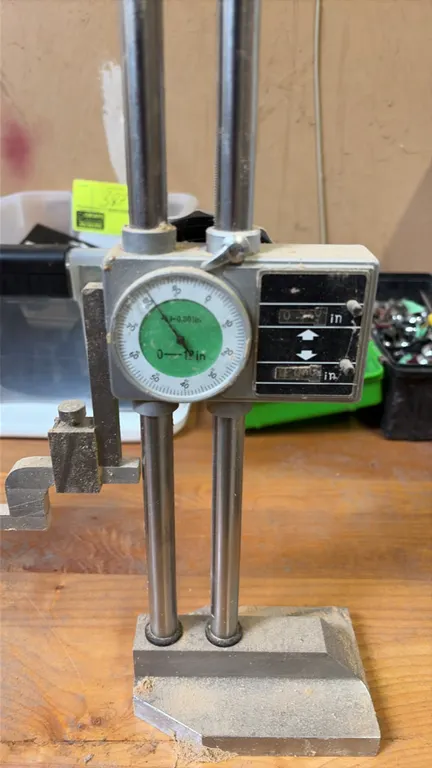 Mitutoyo dial height gage. Features dual-column design, mechanical digital counters, dial indicator with 0.001" graduations (0-1" range), scriber atta