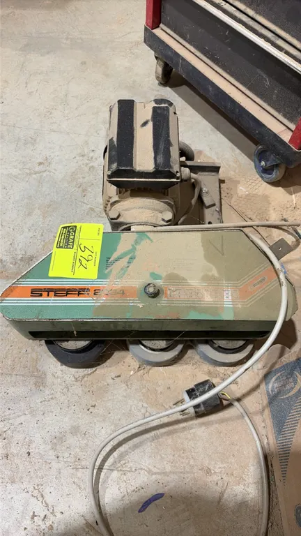 Maggi Steff 2034 power feeder. Features a 3-roller feed design and integrated drive motor with power cord.