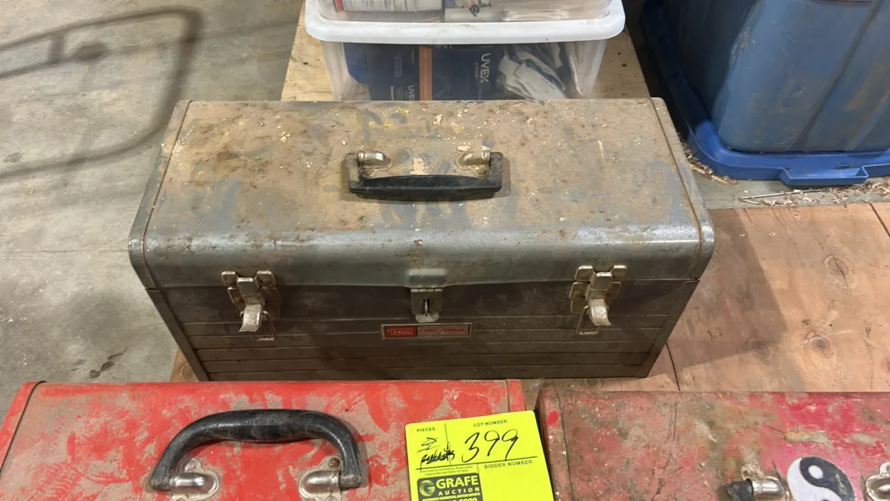 Assorted metal toolboxes. Includes (1) Craftsman gray toolbox with removable interior tray and (2) Waterloo red toolboxes. Features metal latches and