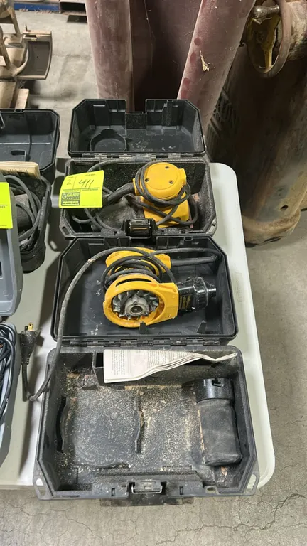 DeWalt corded sanders. Includes hard plastic storage cases and dust collection attachments. Note: One sander is missing its sanding pad assembly.