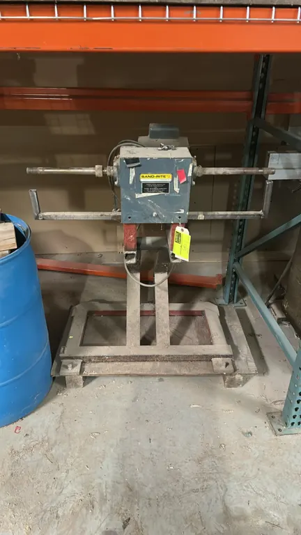 Sand-Rite pneumatic drum contour sander. Features dual-ended spindle arbors and safety rest bar. Mounted on a steel stand. Note: Untested for function