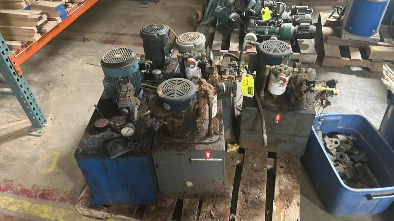 Self-contained industrial hydraulic power units. Lot includes (5) units, each featuring a top-mounted electric motor, rectangular fluid reservoir tank