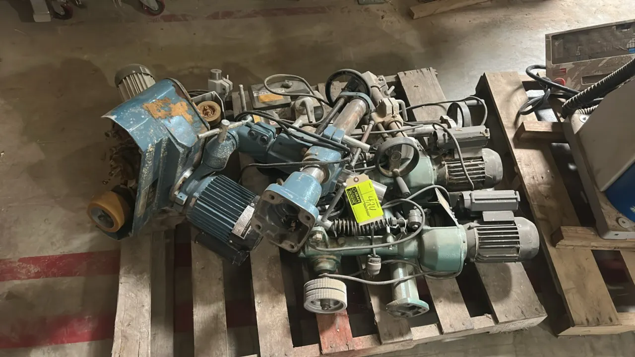 Assorted woodworking power feeder and motorized drive assemblies. Includes (6) units featuring articulated mounting stands, electric drive motors, and