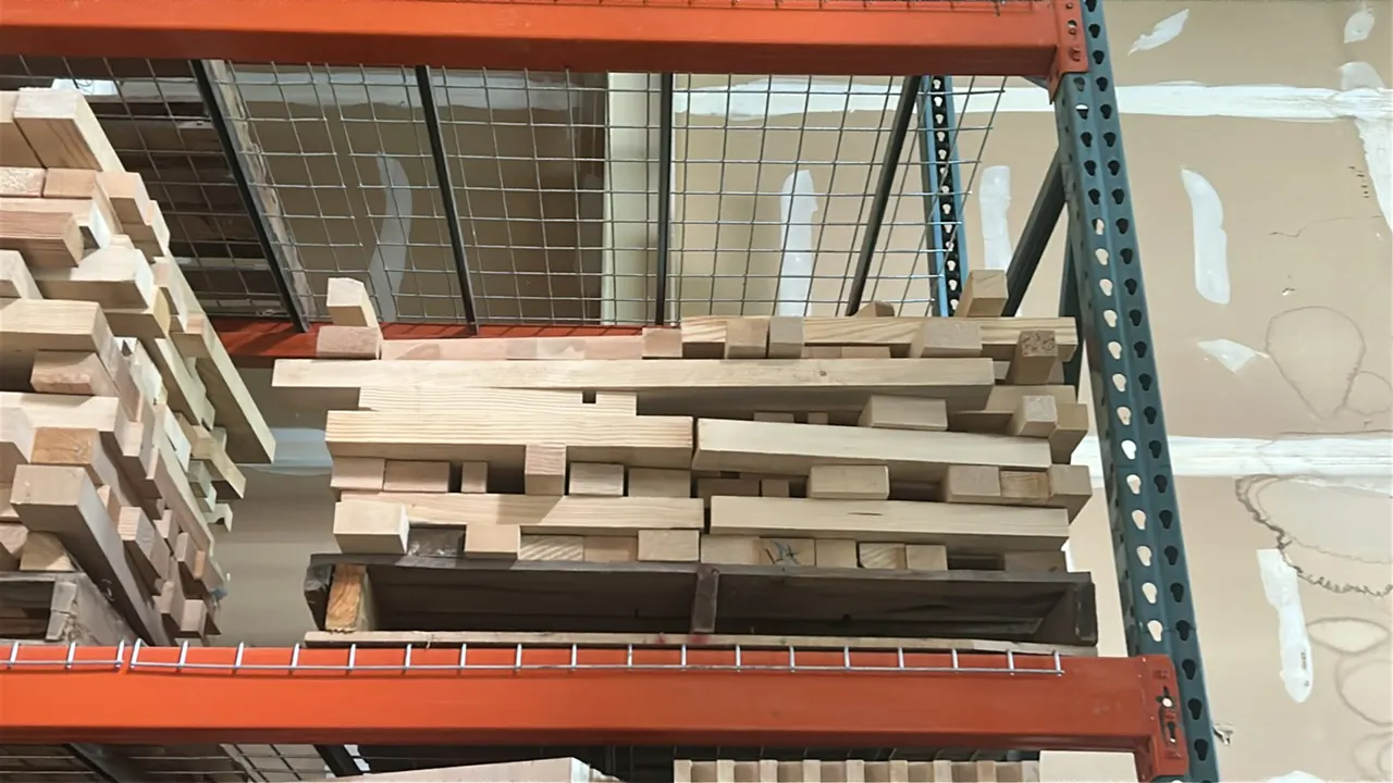 Assorted hardwood lumber lot. Features assorted dimensional hardwood cutoffs stacked on (2) wooden pallets. Note: Pallet racking, wire decking, and su
