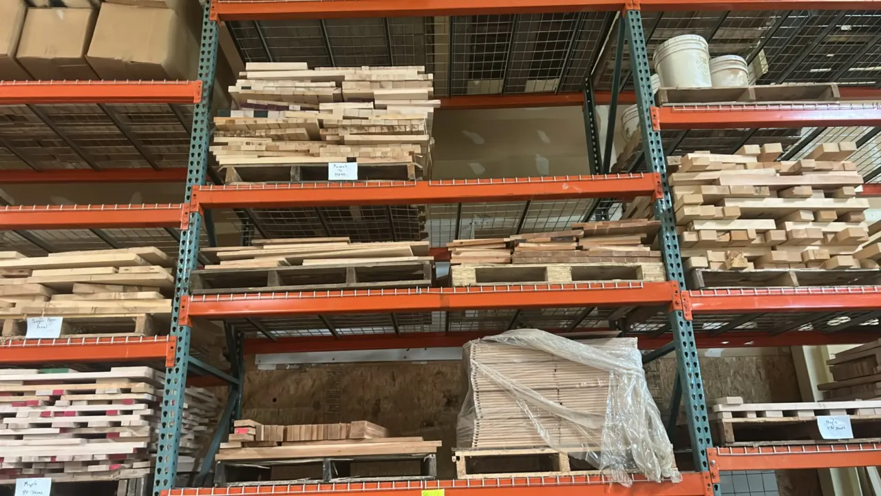 Assorted hardwood lumber and glued-up panels. Includes various species, cuts, dimensional stock, and panel cutoffs. Stored on wooden pallets. Pallet r