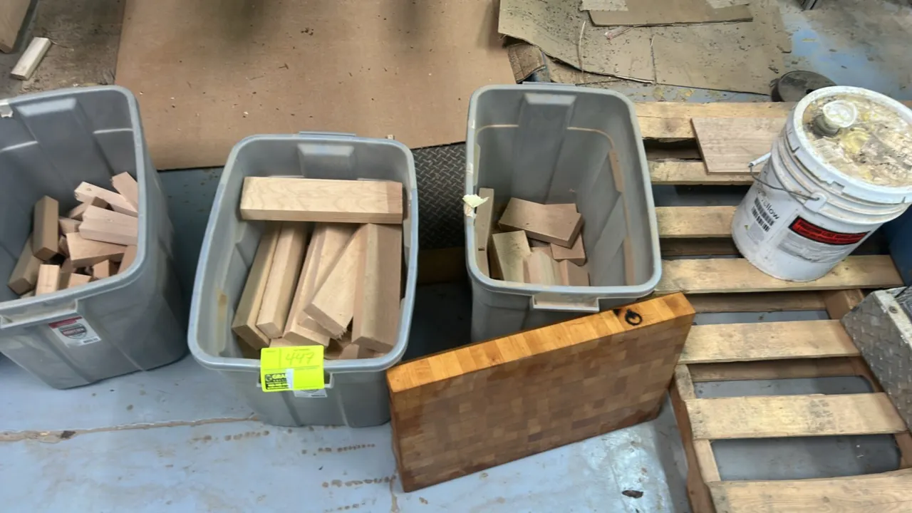 Lot of assorted hardwood and butcher block. Includes (3) plastic storage totes containing various cut hardwood pieces and offcuts, along with (1) thic