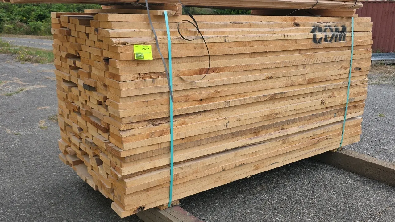Banded bundle of Pacific Northwest Alder lumber. Common grade (COM). Dimensions: Approx. 8'L x 1-1/2" thick (6/4). Tagged with 1,218 board feet. Tag #