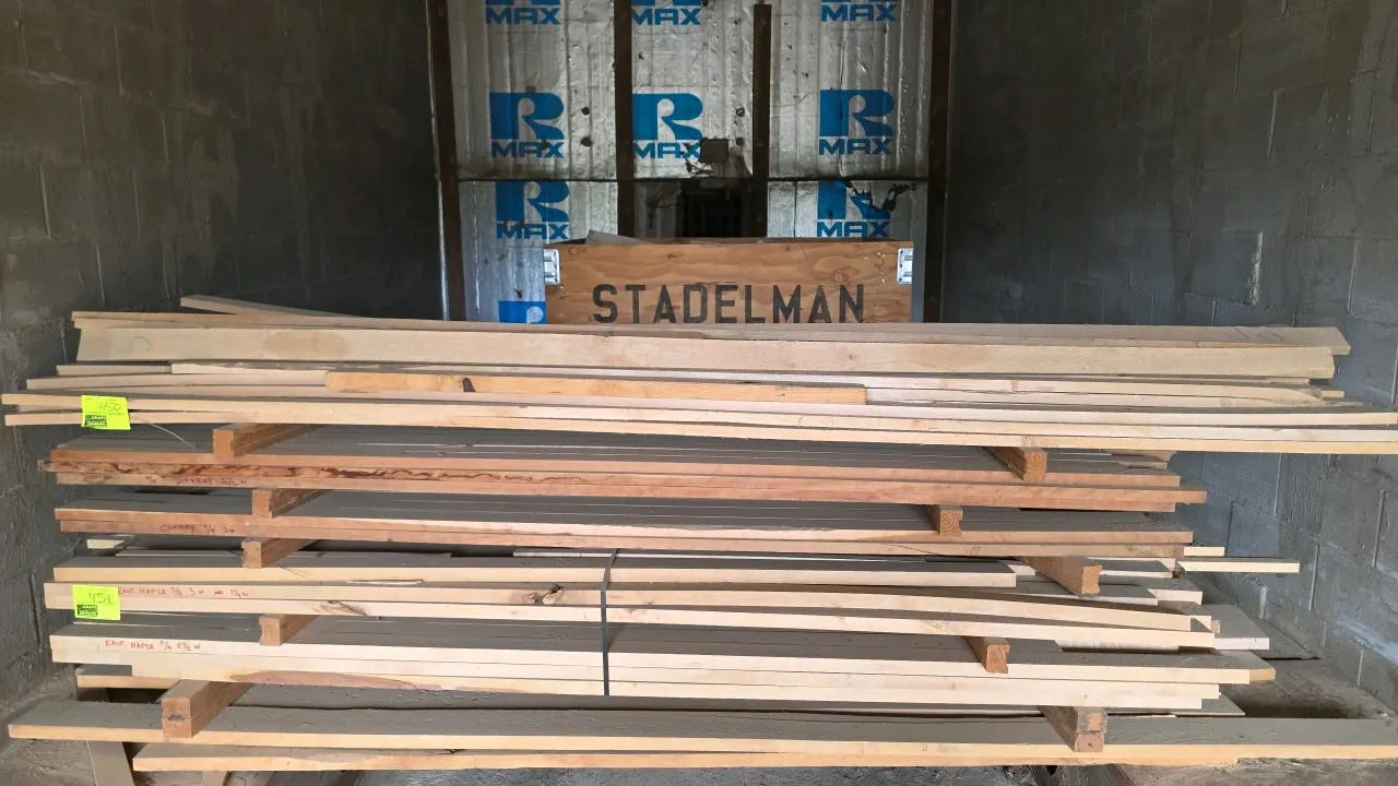 Assorted hardwood lumber stack. Includes approximately 10'L assorted hardwood and 8'5"L x 1"T cherry wood boards. Features marked cherry and eastern m