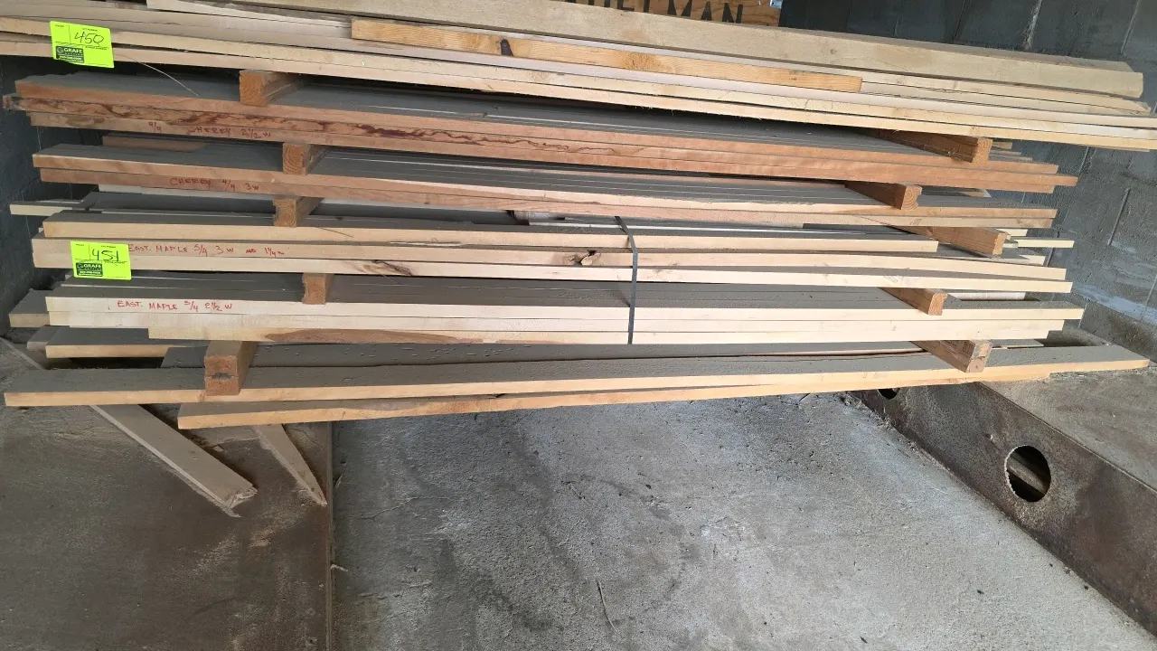 Eastern Maple lumber stack. Features 5/4 (1-1/4" thick) boards in assorted widths of 1-1/4"W, 2-1/2"W, and 3"W. Approx. 8'5"L.