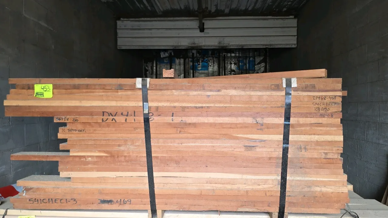 Banded bundle of 5/4 cherry hardwood lumber. Marked 1C 90/70 KD with approx. 469 board feet. Dimensions: Approx. 5' to 6'L x 1-1/4" thick.