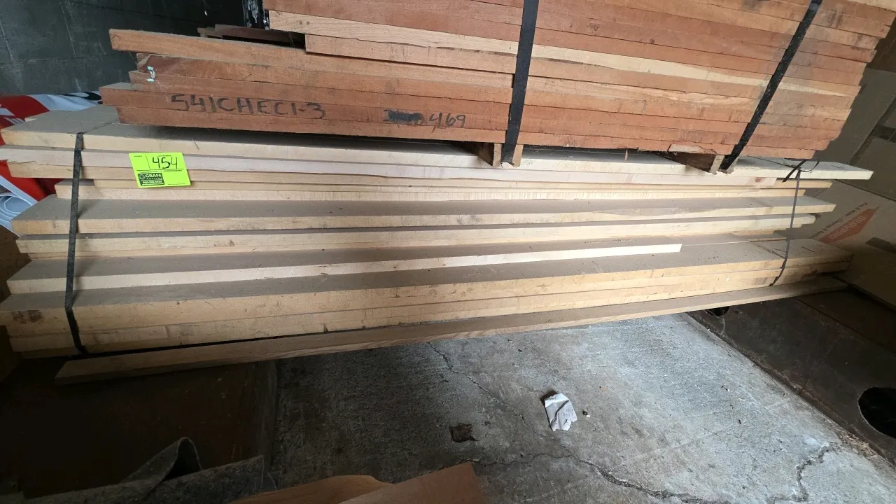 Bundle of hardwood lumber. Dimensions: Approx. 8'6"L x 1"T. Secured with banding. Note: Upper lumber bundle shown stacked on top not included.