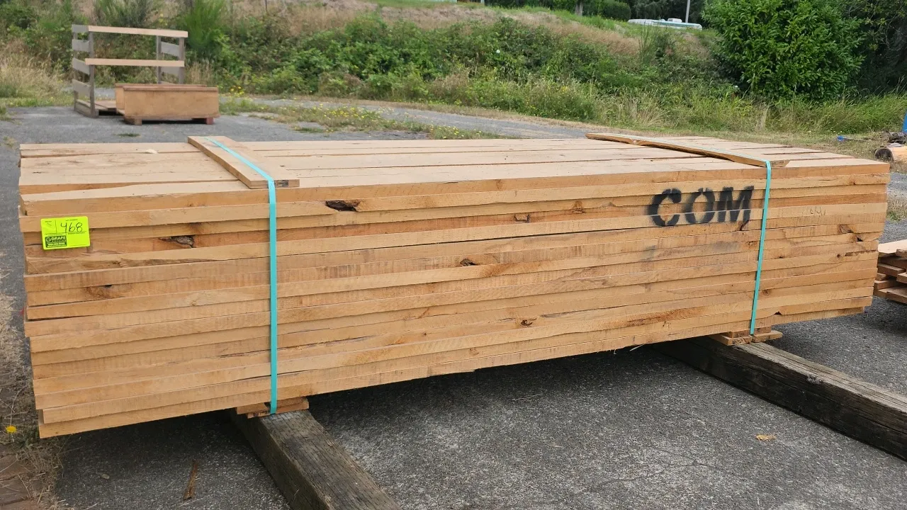Banded bundle of Pacific Northwest Alder lumber. Grade: Common (COM). Thickness: 6/4 (1-1/2"T). Tag indicates 834 board feet. Approx. 10'L.
